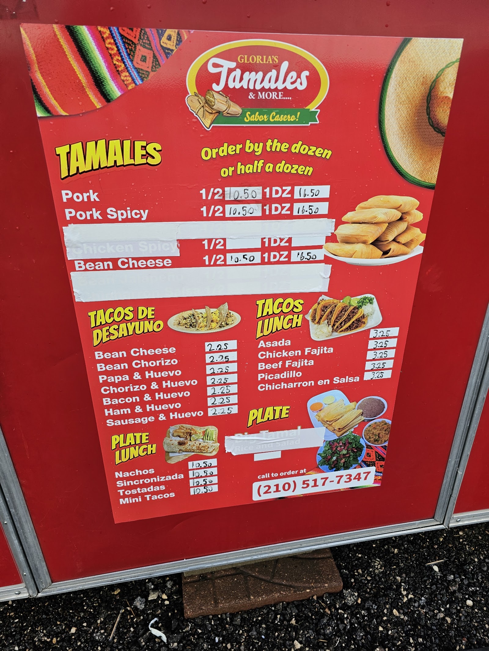 Gloria's Tamales & More menu board with tamales and tacos